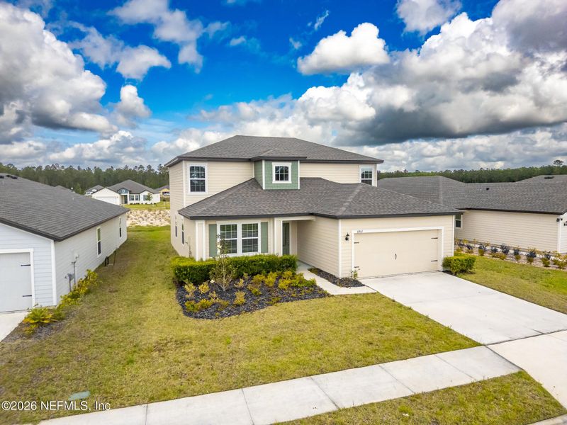 Front exterior of a new home in Westport Landing, Jacksonville, FL, highlighting curb appeal (Image 25).