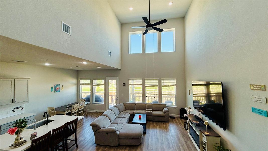 A grand living space with soaring ceilings and abundant natural light.