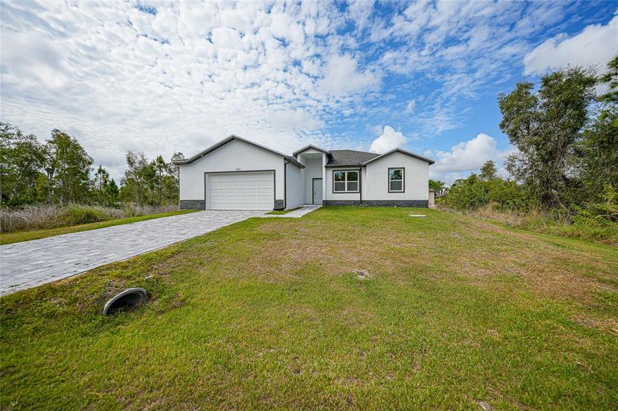 Front exterior of a new home in , Port Charlotte, FL, highlighting curb appeal (Image 27).