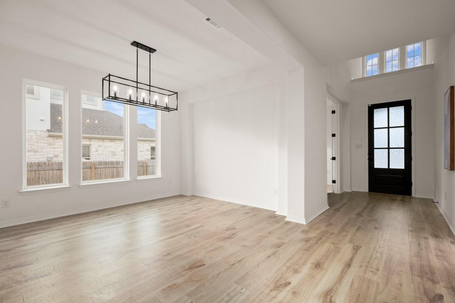 Elegant formal dining stretches off the entry foyer and offers excellent flexibility for use of space. Elegant formal dining stretches off the entry foyer and offers excellent flexibility for use of space.