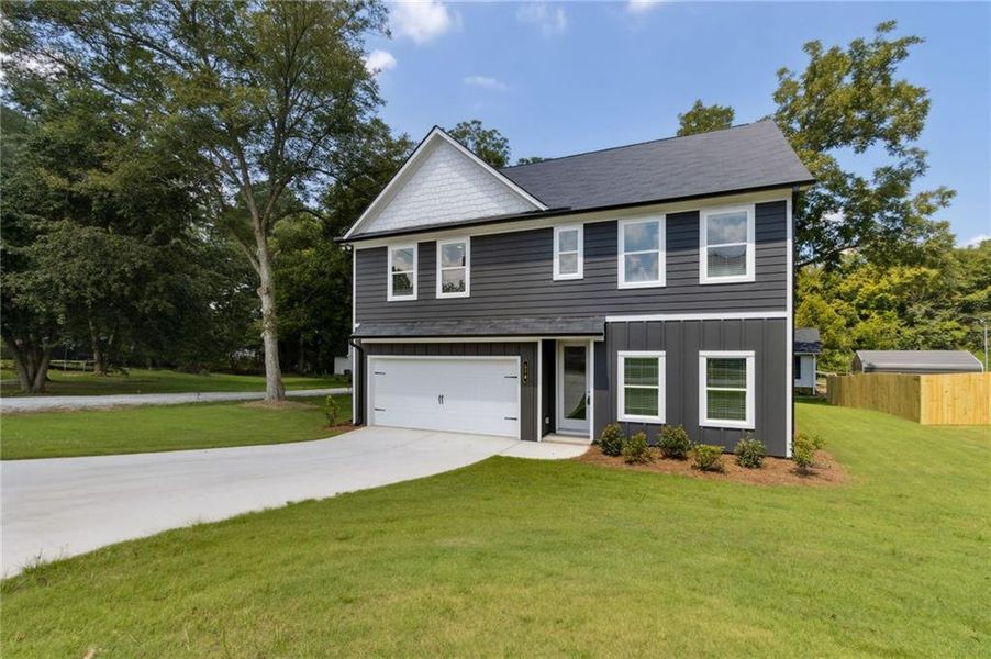 Front exterior of a new home in , Hoschton, GA, highlighting curb appeal (Image 26). Front exterior of a new home in , Hoschton, GA, highlighting curb appeal (Image 26).