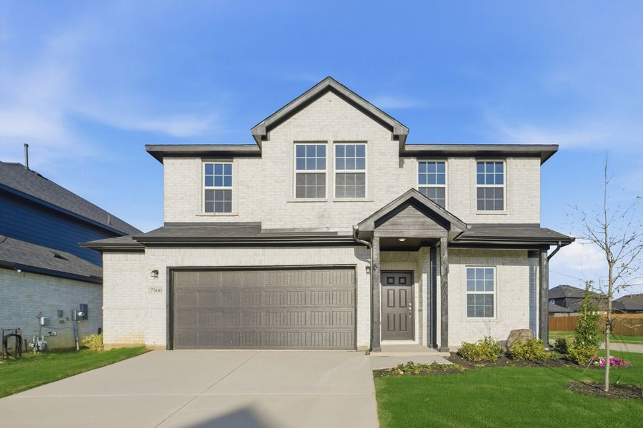 Front exterior of a new home in Sagebrook, Argyle, TX, highlighting curb appeal (Image 1). Front exterior of a new home in Sagebrook, Argyle, TX, highlighting curb appeal (Image 1).