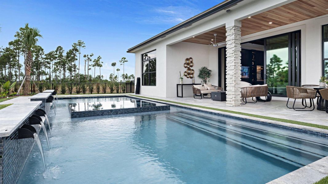 Front exterior of a new home in L'Ambiance at Avenir, Palm Beach Gardens, FL, highlighting curb appeal (Image 20). Front exterior of a new home in L'Ambiance at Avenir, Palm Beach Gardens, FL, highlighting curb appeal (Image 20).