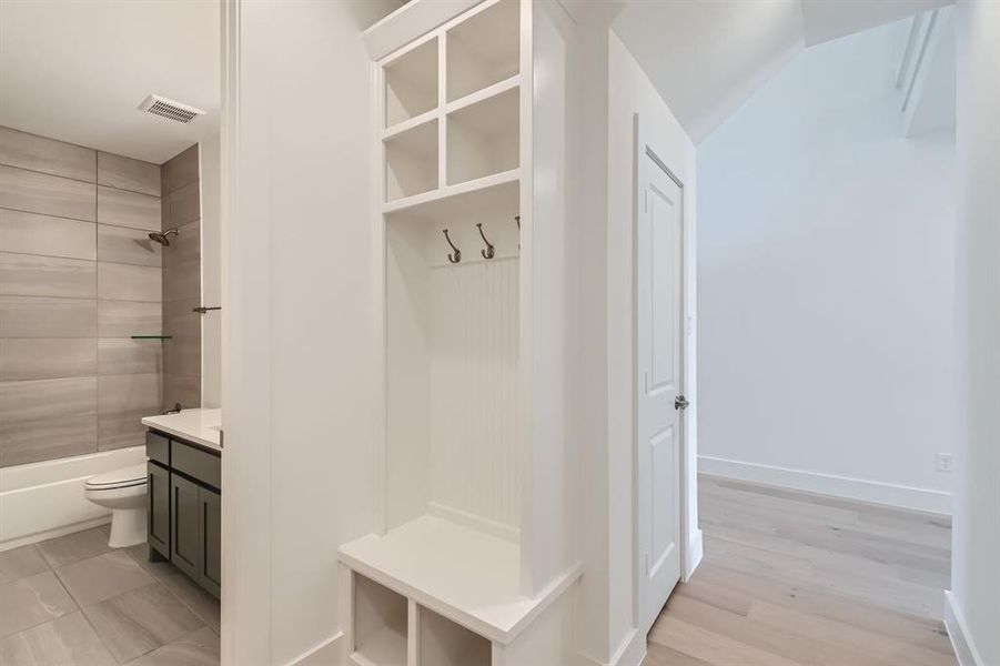 Mudroom with light wood-type flooring