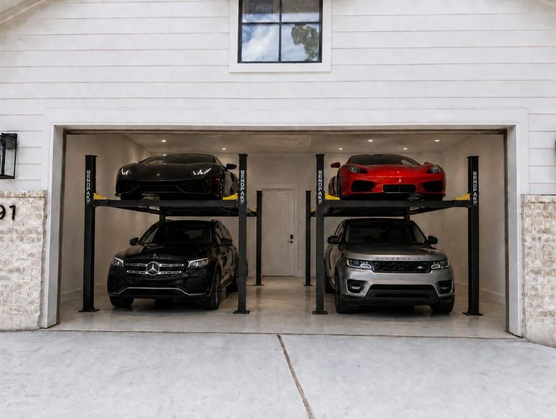 Garage built specifically to accommodate two car lifts!Photo digitally staged using AI. Garage built specifically to accommodate two car lifts!Photo digitally staged using AI.