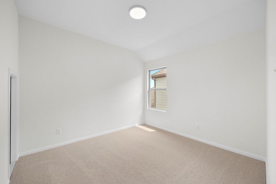 Bedroom in the Magnolia home plan by Trophy Signature Homes – REPRESENTATIVE PHOTO