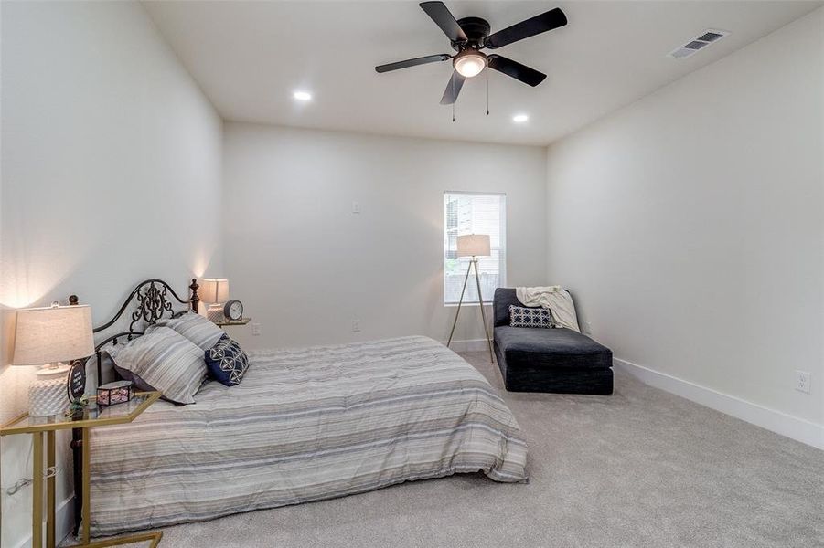 Bedroom featuring carpet floors and ceiling fan