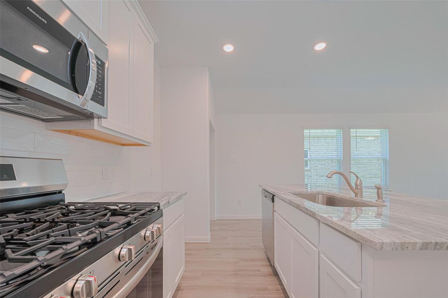Furnished interior view inside a new home in Sunterra, Katy (Image 15).