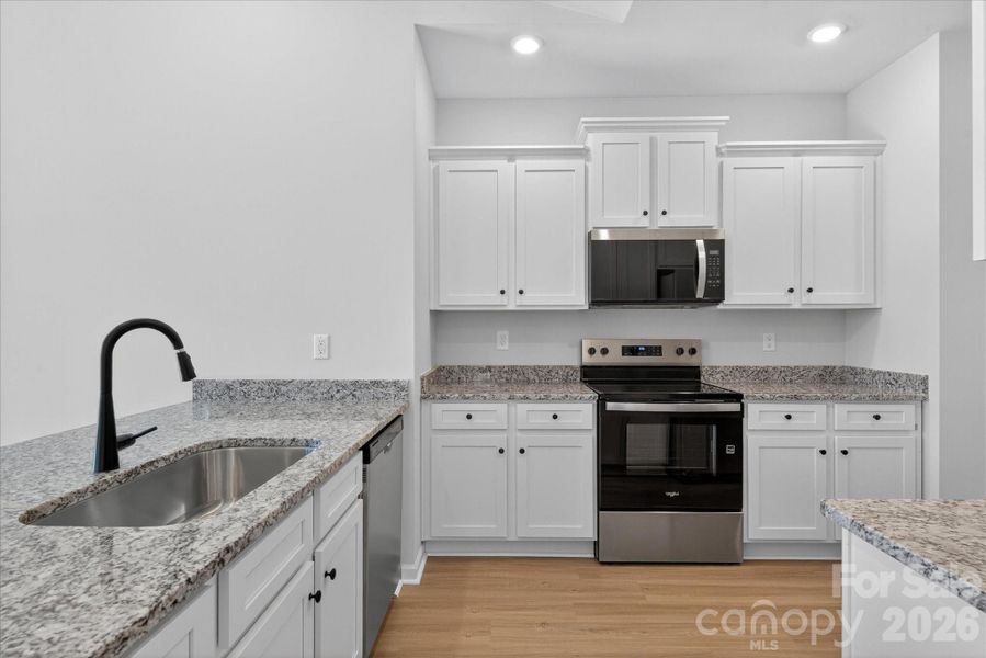 Furnished interior view inside a new home in Stagecoach Station, Gastonia (Image 9).