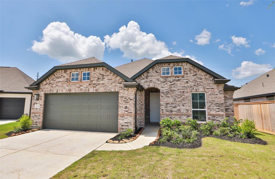 Front exterior of a new home in Oakwood Estates, Waller, TX, highlighting curb appeal (Image 22). Front exterior of a new home in Oakwood Estates, Waller, TX, highlighting curb appeal (Image 22).