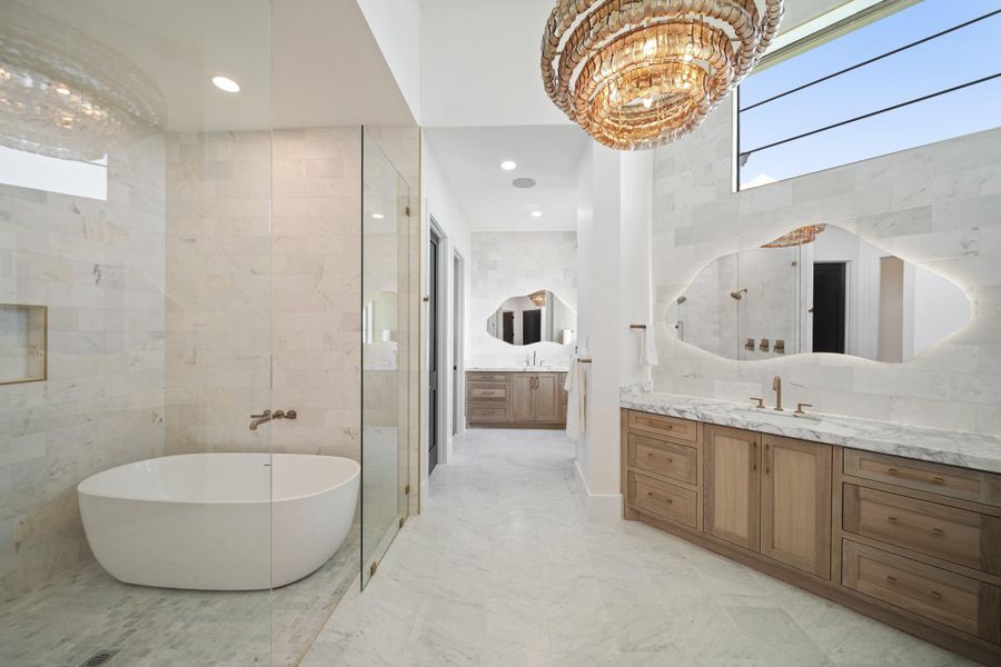 Unwind in your spa like bathroom. Shower and bathe in the marble filled wet-room that has THREE showerheads. Two private commodes are found in the primary bathroom.