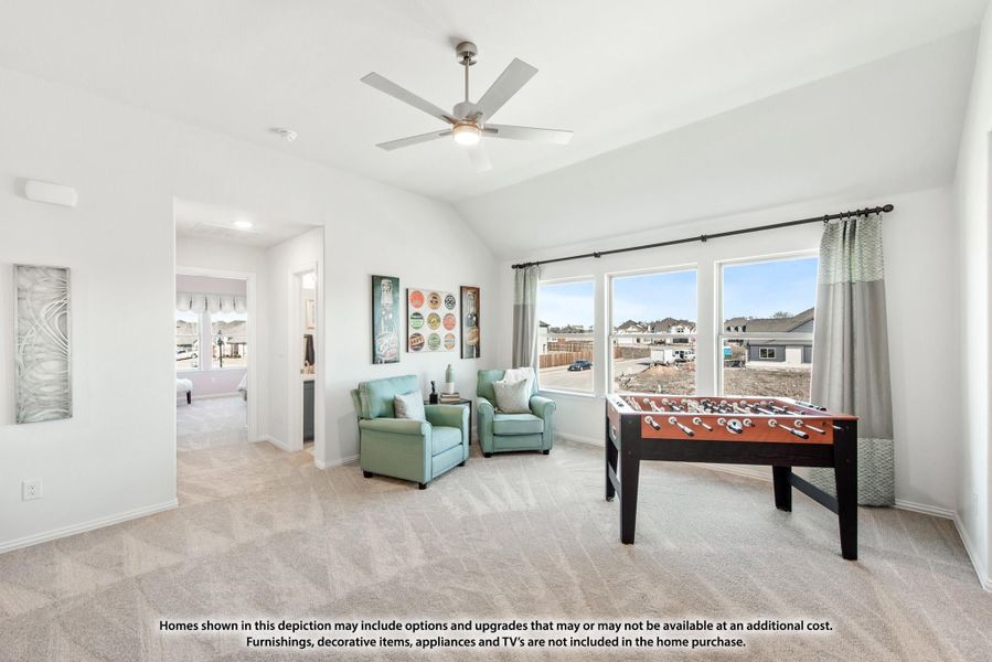 Bonus room with foosball table, two armchairs, ceiling fan, and large windows overlooking neighborhood Bonus room with foosball table, two armchairs, ceiling fan, and large windows overlooking neighborhood