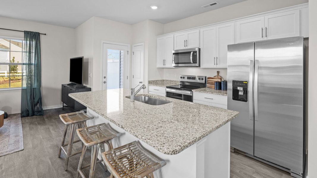 Furnished interior view inside a new home in The Townes at Ridgewood Farms, Winterville (Image 5).