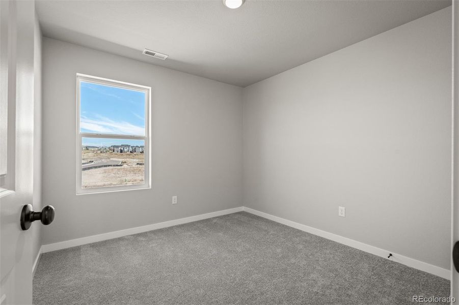 Spacious, unfurnished interior of a new home in Revel Crossing at Wolf Ranch – The Ascent Collection, Colorado Springs (Image 20).