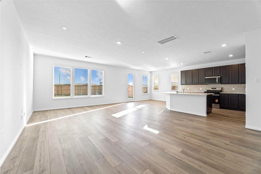 Stunning open-concept design seamlessly connecting the living, dining, and kitchen areas—perfect for both everyday living and entertaining! Stunning open-concept design seamlessly connecting the living, dining, and kitchen areas—perfect for both everyday living and entertaining!