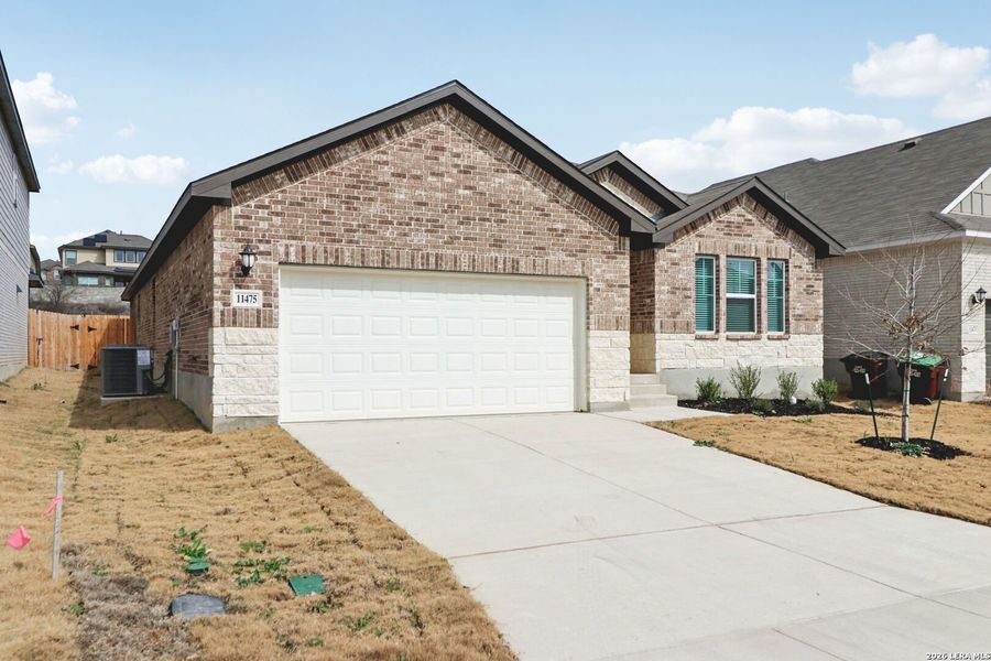 Front exterior of a new home in Sagebrooke - Classic Series, San Antonio, TX, highlighting curb appeal (Image 24).