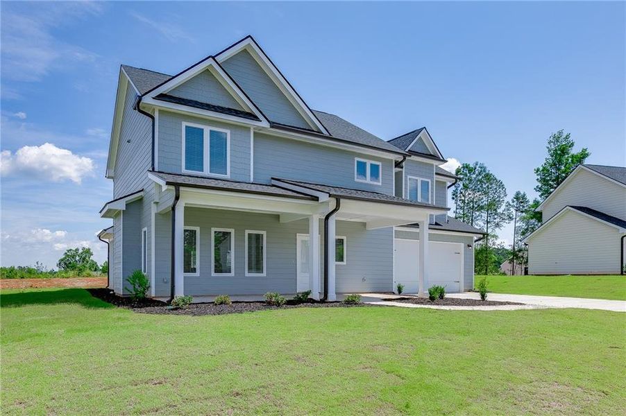 Front exterior of a new home in , Toccoa, GA, highlighting curb appeal (Image 23). Front exterior of a new home in , Toccoa, GA, highlighting curb appeal (Image 23).