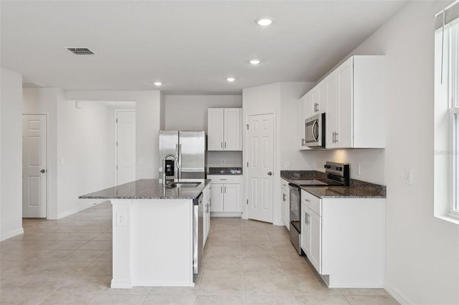 Furnished interior view inside a new home in Lake Deer Estates - Signature Series, Poinciana (Image 4).