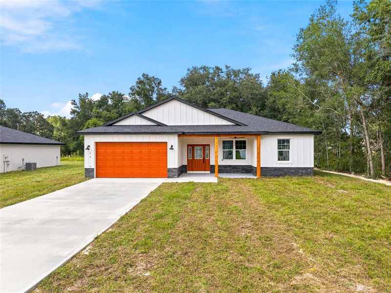 Front exterior of a new home in , Dunnellon, FL, highlighting curb appeal (Image 21).