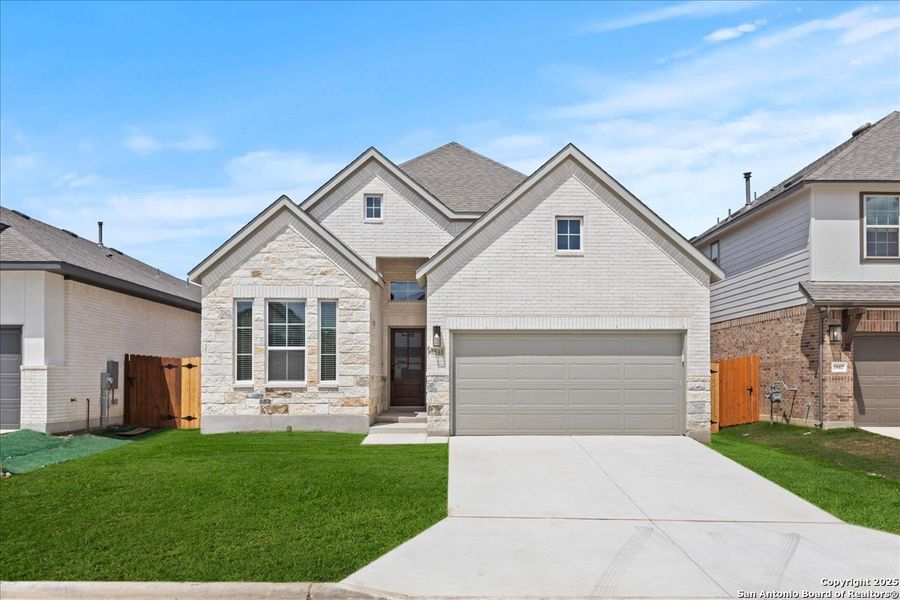 Front exterior of a new home in Meyer Ranch, New Braunfels, TX, highlighting curb appeal (Image 1). Front exterior of a new home in Meyer Ranch, New Braunfels, TX, highlighting curb appeal (Image 1).