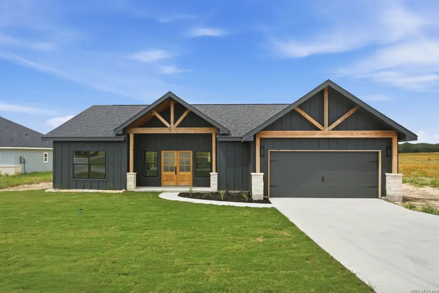 Front exterior of a new home in , La Vernia, TX, highlighting curb appeal (Image 2). Front exterior of a new home in , La Vernia, TX, highlighting curb appeal (Image 2).
