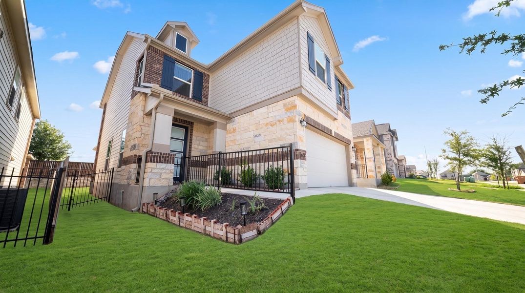 A well-maintained lawn and tasteful landscaping welcome residents to this charming home with an attached garage. A well-maintained lawn and tasteful landscaping welcome residents to this charming home with an attached garage.