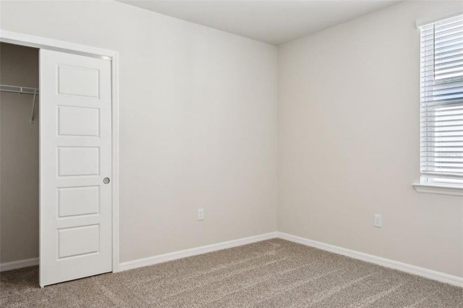 Spacious, unfurnished interior of a new home in Crescent Lakes - Premier Series, Punta Gorda (Image 18).