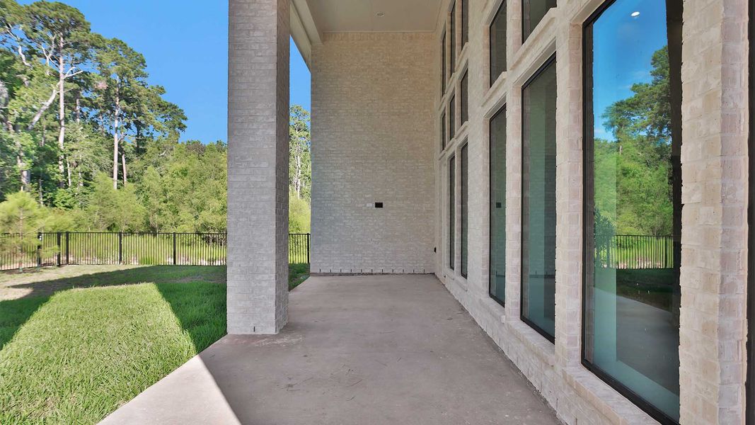 Exterior details and patio area of a home in The Woodlands Hills, Willis (Image 3). Exterior details and patio area of a home in The Woodlands Hills, Willis (Image 3).