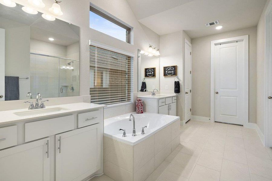 Primary bath with clean finishes and generous space.