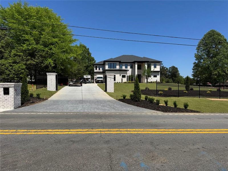 Front exterior of a new home in , Buford, GA, highlighting curb appeal (Image 17).