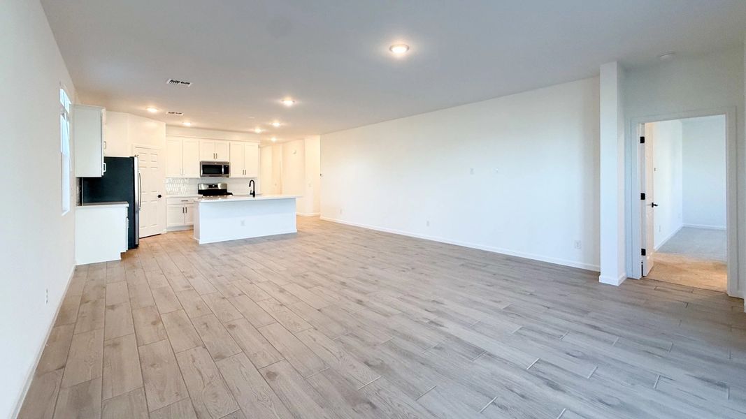 Great room, dining and kitchen Great room, dining and kitchen