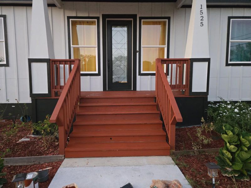 Doorway to property with board and batten siding