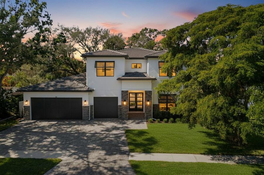 Front exterior of a new home in , Sarasota, FL, highlighting curb appeal (Image 24).