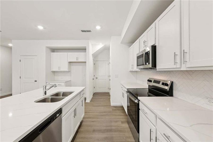 Furnished interior view inside a new home in Eastlyn Crossing, Flowery Branch (Image 10).