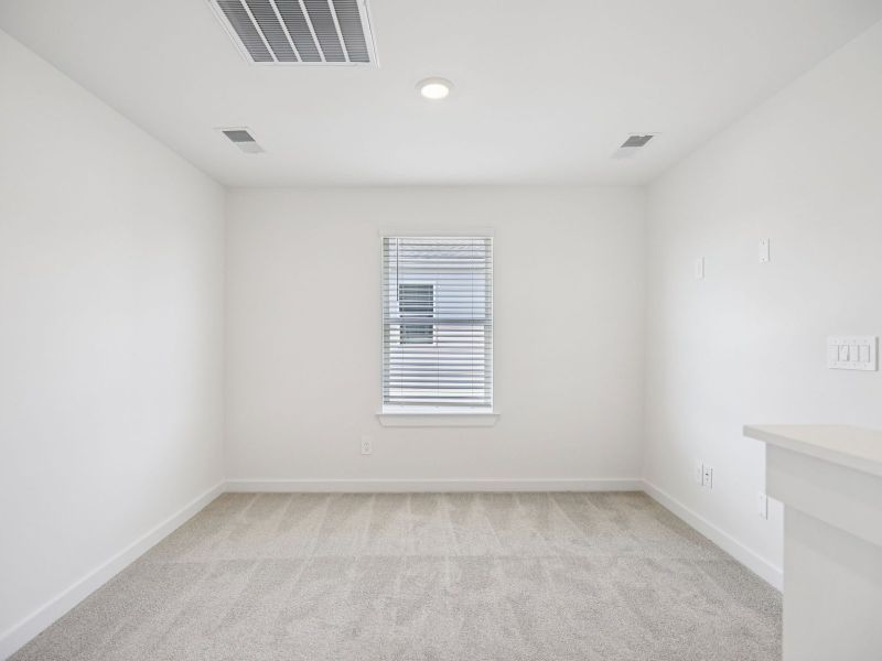The upstairs loft gives the kids a place to study.