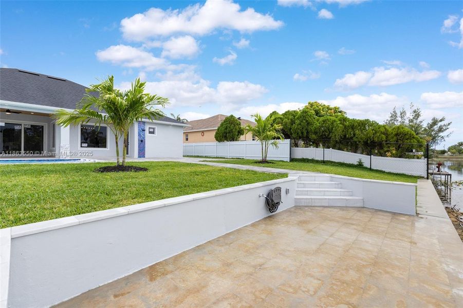 Front exterior of a new home in , Cape Coral, FL, highlighting curb appeal (Image 25). Front exterior of a new home in , Cape Coral, FL, highlighting curb appeal (Image 25).