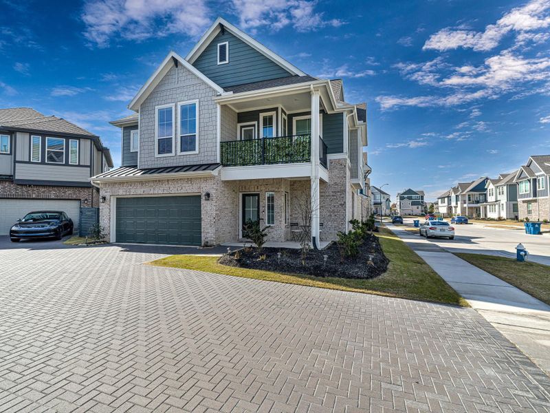Front exterior of a new home in Bridgeland, Cypress, TX, highlighting curb appeal (Image 2). Front exterior of a new home in Bridgeland, Cypress, TX, highlighting curb appeal (Image 2).