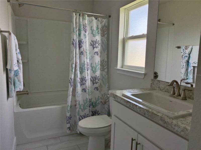 Furnished interior view inside a new home in Sunset Landing, Spring Hill (Image 13).