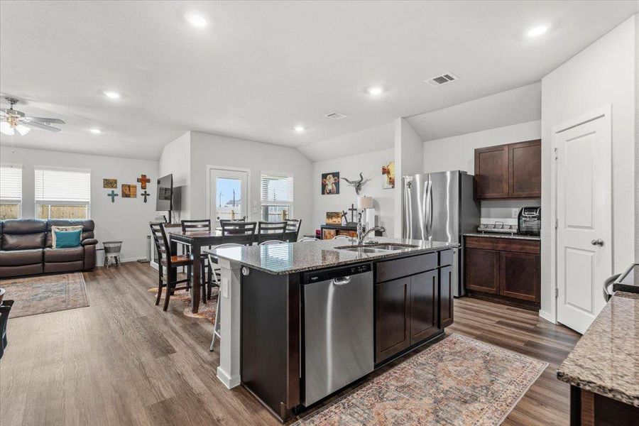 Kitchen with open view to living room.