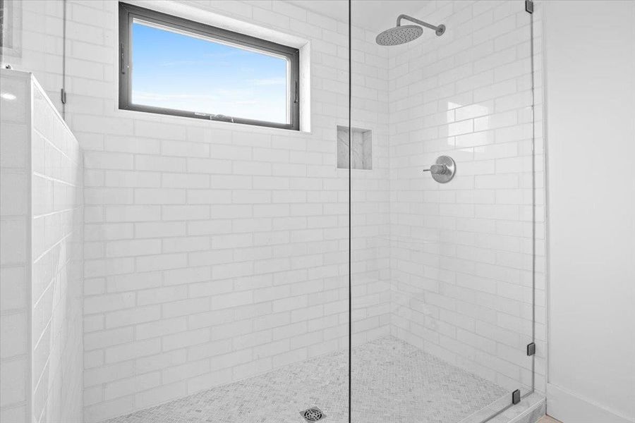 Full bath featuring a stall shower