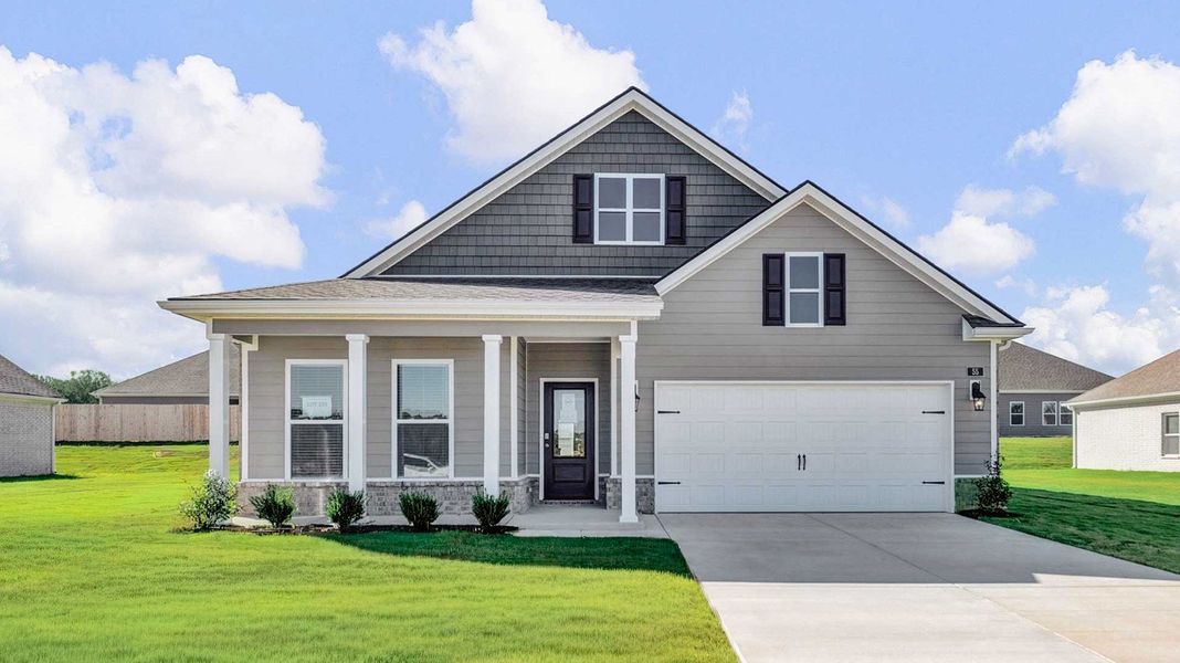 Front exterior of a new home in The Orchard, Millington, TN, highlighting curb appeal (Image 2).