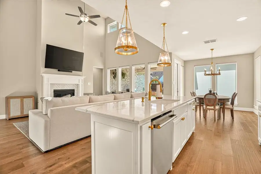 Spacious open-concept interior featuring wood-finish flooring throughout Spacious open-concept interior featuring wood-finish flooring throughout