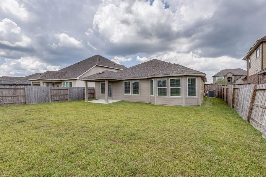 Front exterior of a new home in Sierra Vista, Iowa Colony, TX, highlighting curb appeal (Image 18). Front exterior of a new home in Sierra Vista, Iowa Colony, TX, highlighting curb appeal (Image 18).