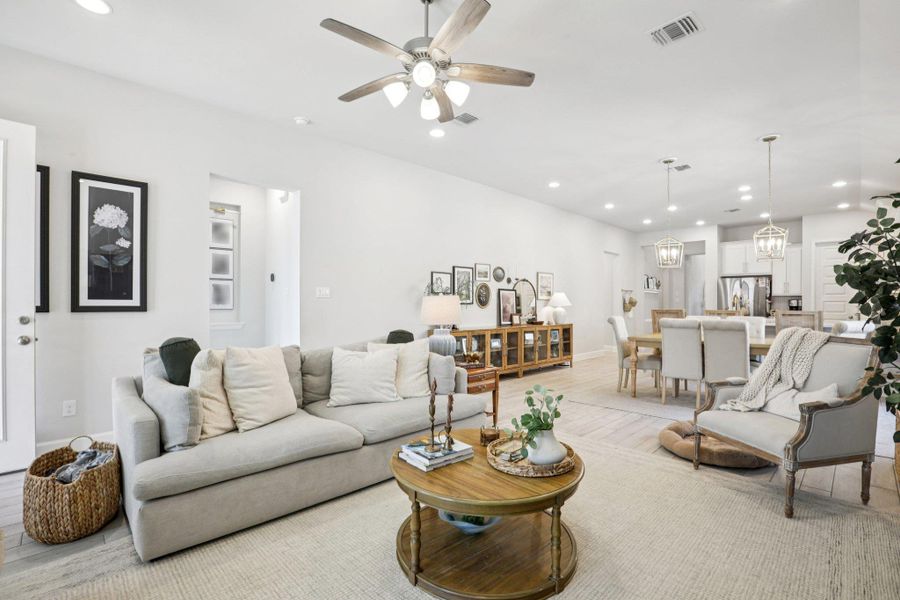 Living area featuring recessed lighting, wood finished floors, and ceiling fan