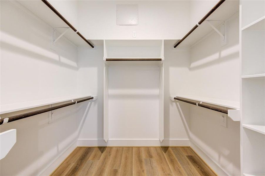 Large walk-in closet in primary bedroom.