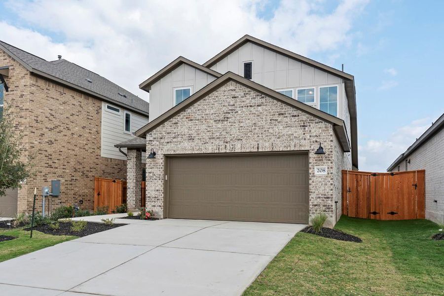 Front exterior of a new home in Lariat, Liberty Hill, TX, highlighting curb appeal (Image 22).