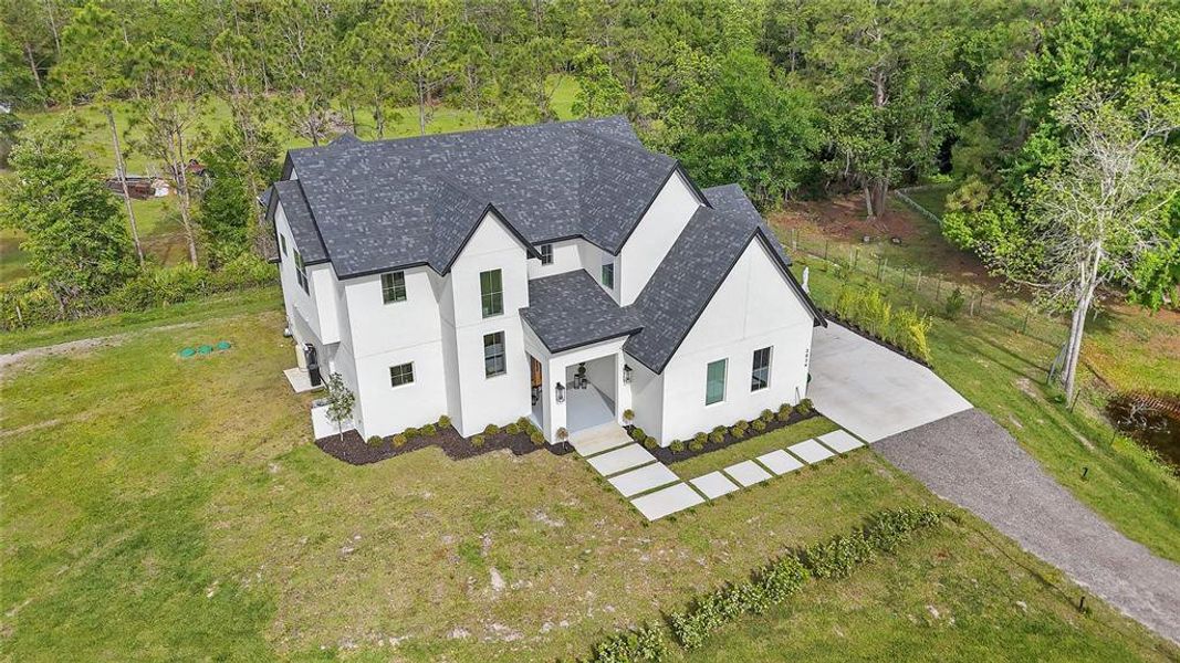 Front exterior of a new home in , St. Cloud, FL, highlighting curb appeal (Image 24).
