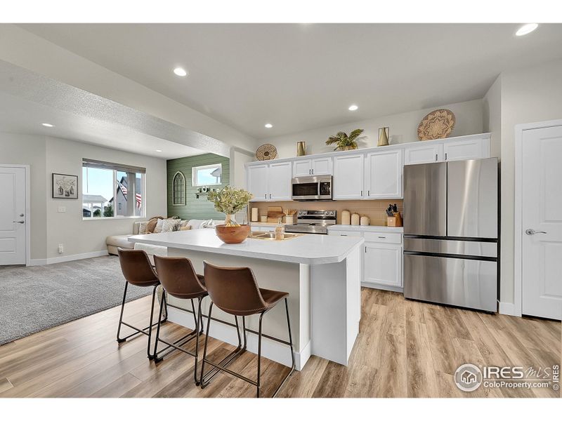 Kitchen with Island and Stainless Steel appliances