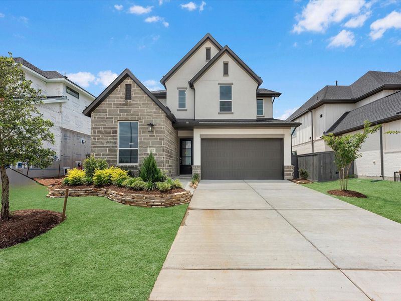 Front exterior of a new home in Jubilee 50′, Hockley, TX, highlighting curb appeal (Image 2). Front exterior of a new home in Jubilee 50′, Hockley, TX, highlighting curb appeal (Image 2).
