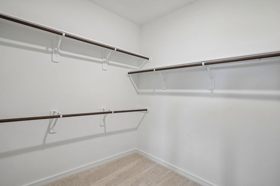 Primary walk-in closet (*Photo not of actual home and used for illustration purposes only.) Primary walk-in closet (*Photo not of actual home and used for illustration purposes only.)